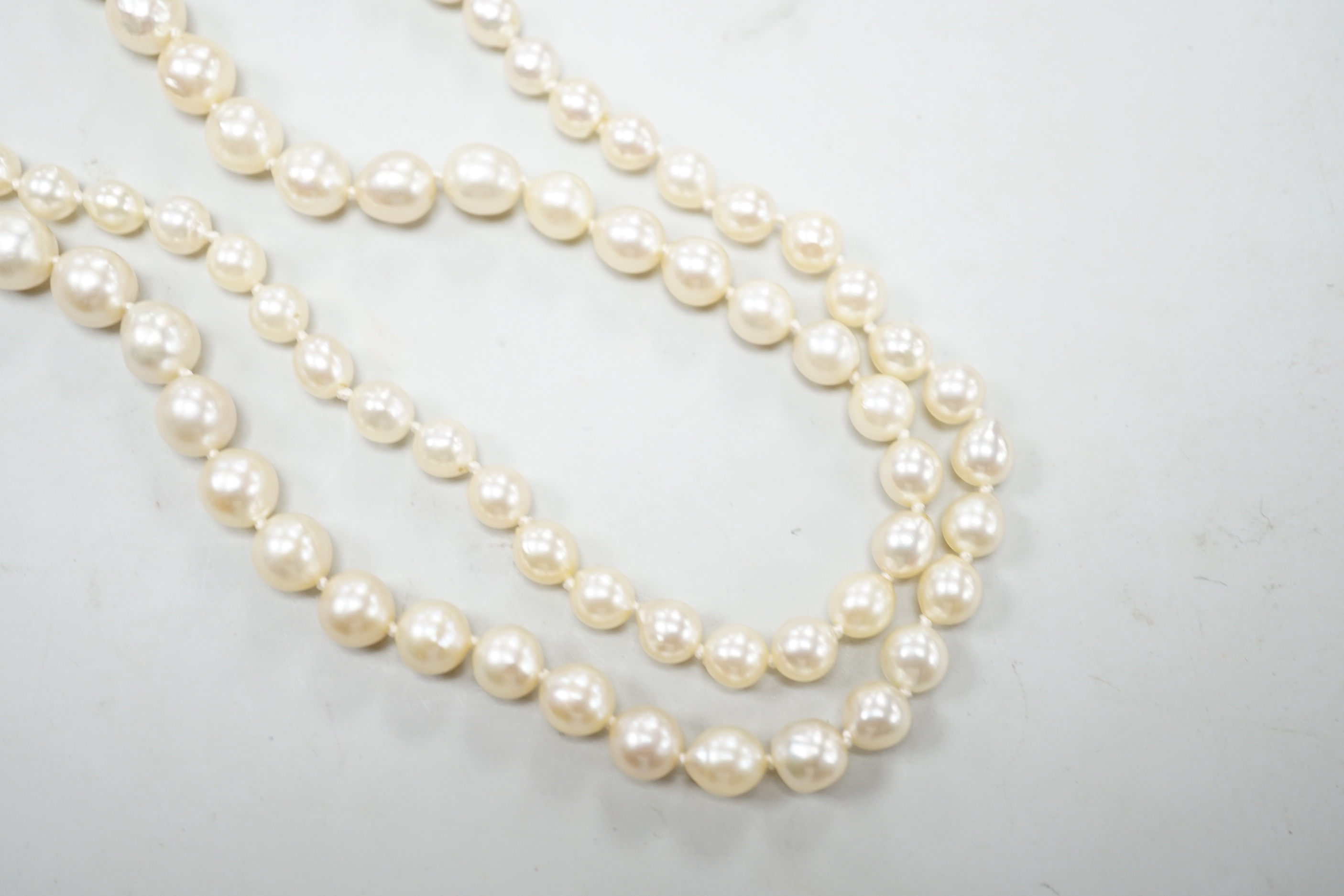 A single strand graduated cultured pearl necklace, now with an earlier 19th century seed pearl and plaited hair set clasp, 76cm, together with original clasp.